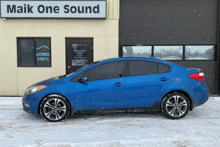 2015 Kia Forte with professional window tint in North Bay